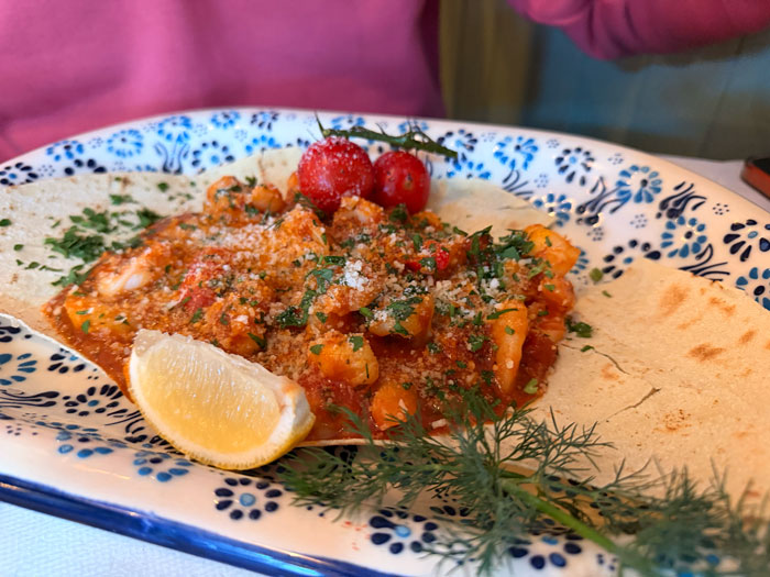 King prawns in rich tomato sauce on flatbread at Amici Ristorante Italiano, Ashford