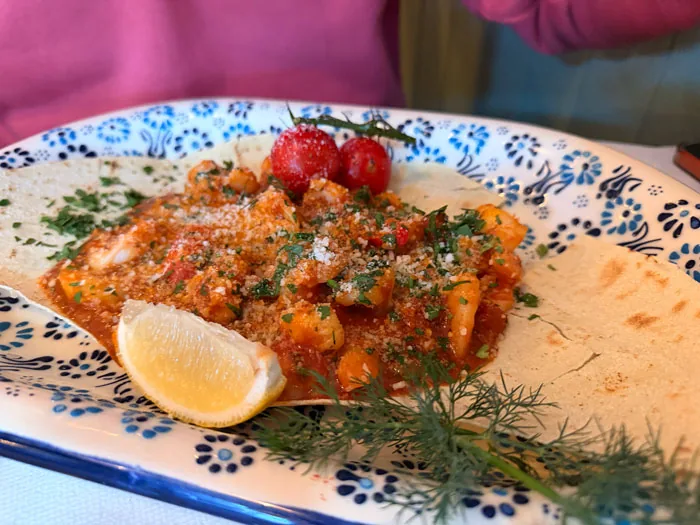 King prawns in rich tomato sauce on flatbread at Amici Ristorante Italiano, Ashford