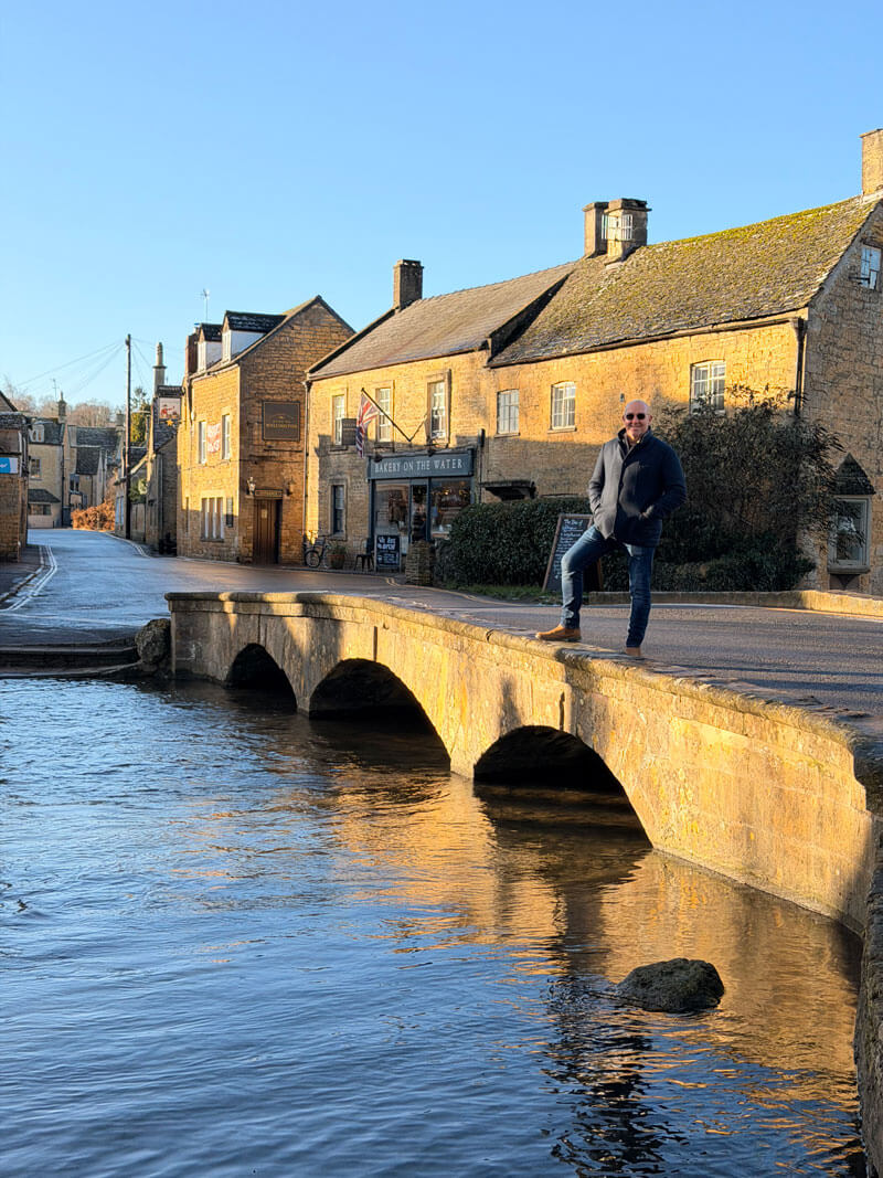 Walking across the low bridges over the River Windrush in Bourton-on-the-Water, the Cotswolds