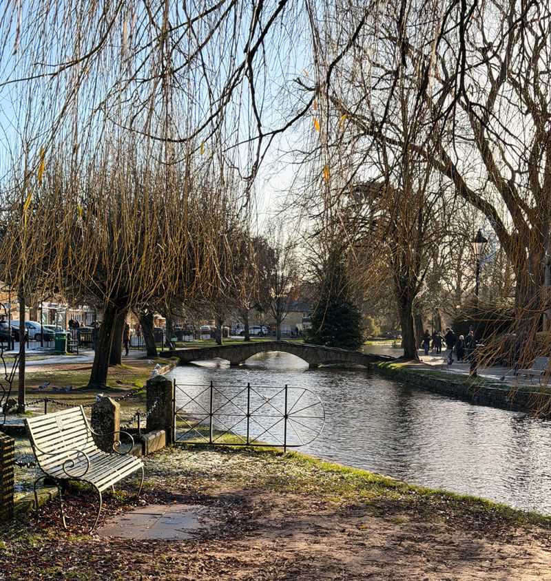 Bourton-on-the-Water village bridges reflected in the River Windrush, Cotswolds