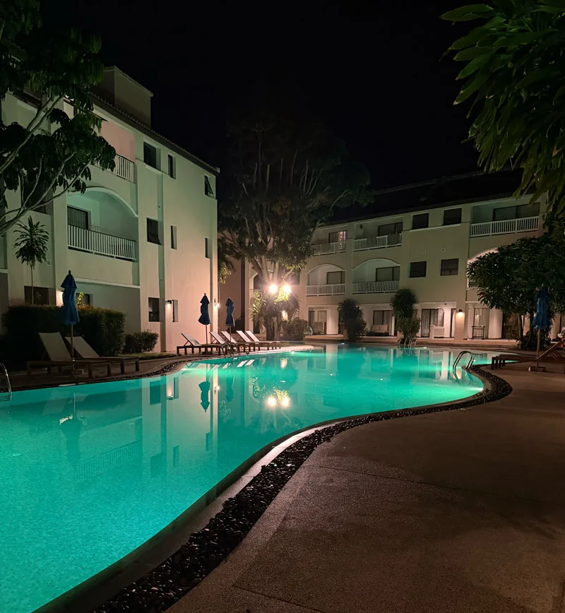 Celeste Hotel swimming pool at night, illuminated and overlooking the sea in Koh Samui, Thailand