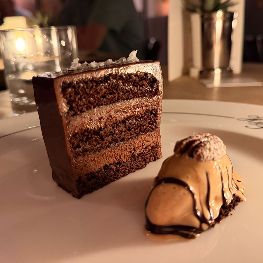 A slice of chocolate and ale cake with ice cream