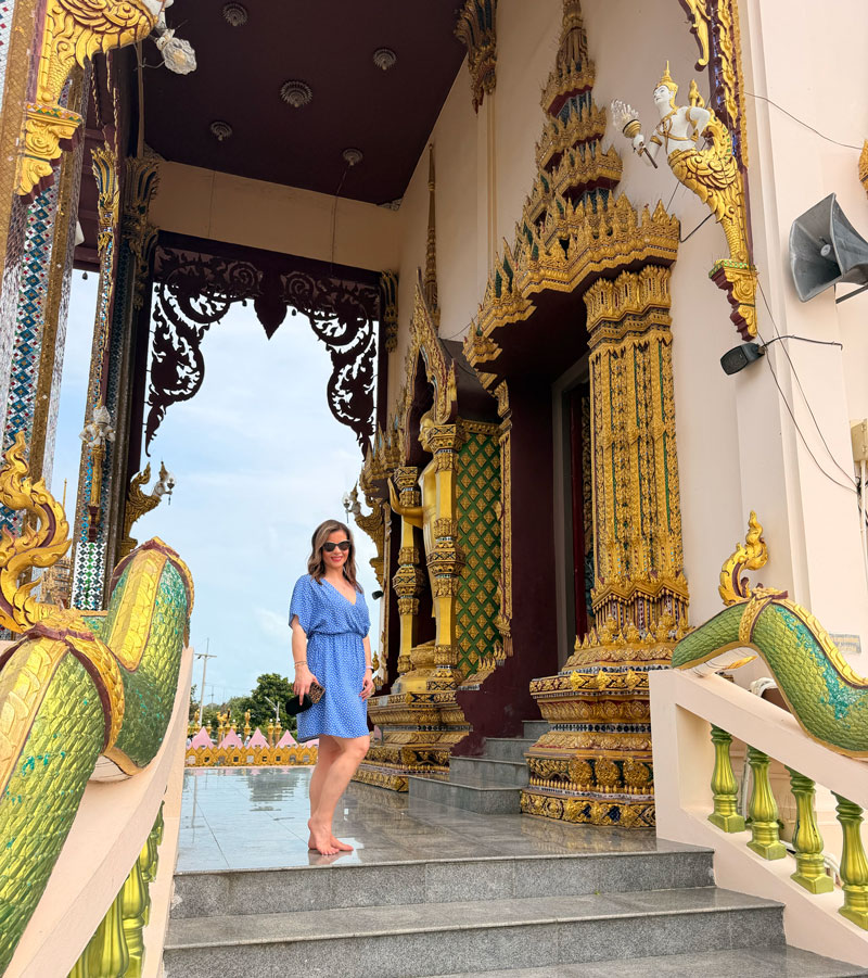 Buddhist temple complex in Koh Samui, Thailand, with multi-armed statue and ornate architecture