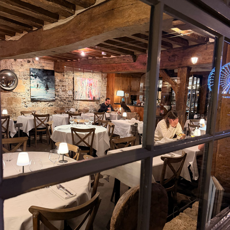 L'Absinthe restaurant on Quai de la Quarantaine, Honfleur, Normandy — stone walls and exposed beams