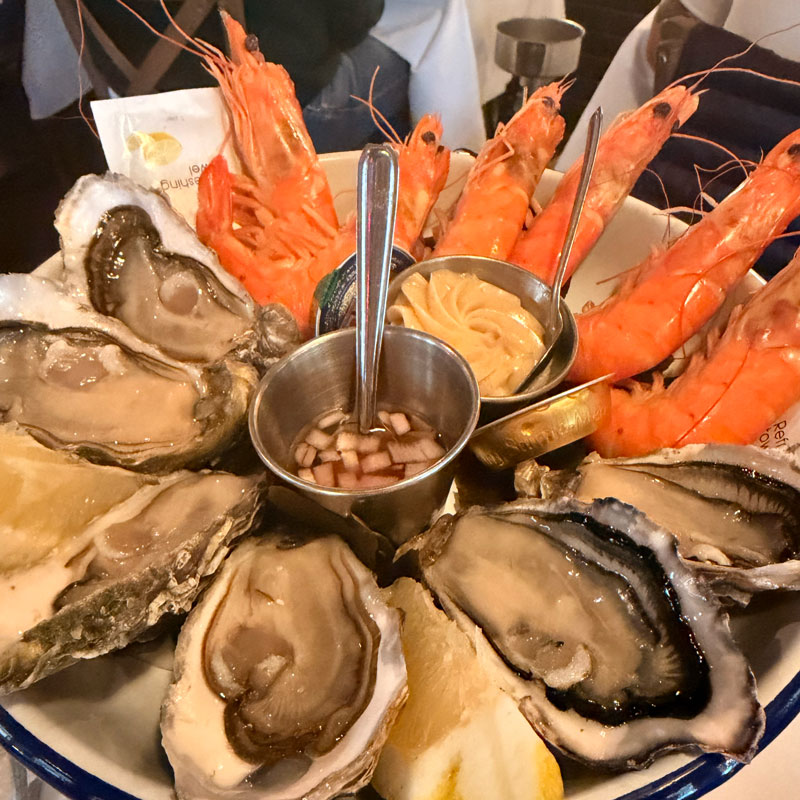 Garlic prawns starter at L'Absinthe, a classic harbour-side restaurant in Honfleur, Normandy