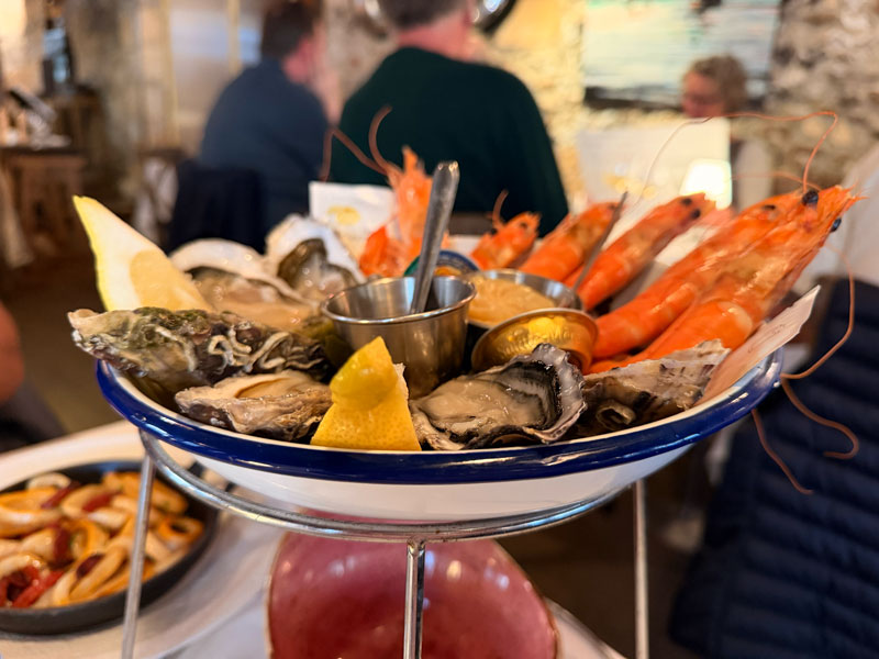 Starter of prawns and oysters at L'Absinthe restaurant on the harbour in Honfleur, Normandy