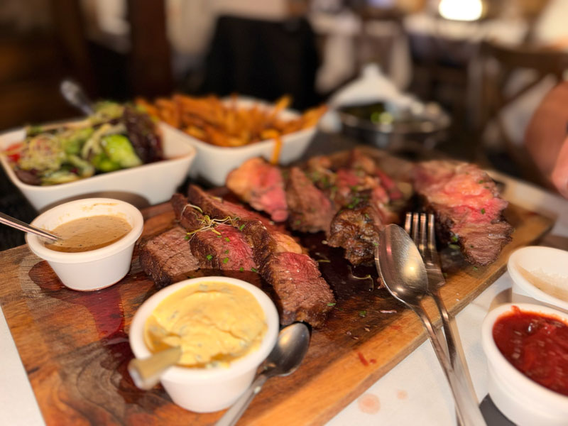 Giant sharing steak at L'Absinthe restaurant in Honfleur, Normandy — big enough for four