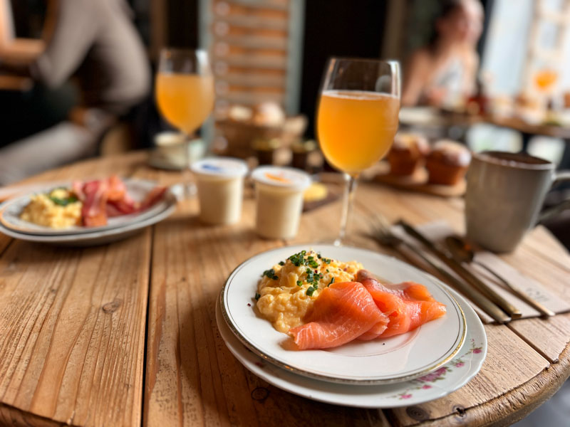 Full English breakfast spread at La Maison du Tripot in Honfleur with homemade bread, jams and muffins