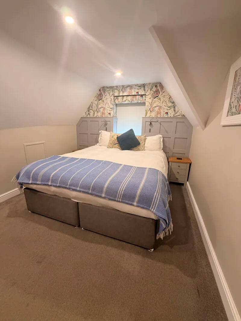 Cosy bedroom at the Old New Inn Bourton-on-the-Water with large comfortable bed and Cotswolds decor