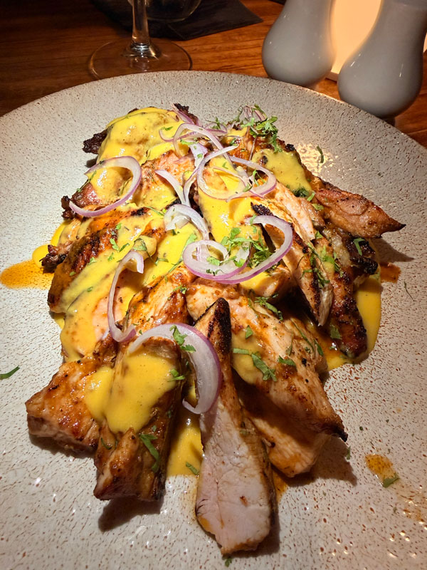 Pollo al Josper — Josper-grilled half chicken with Peruvian crema at Baia Barbados