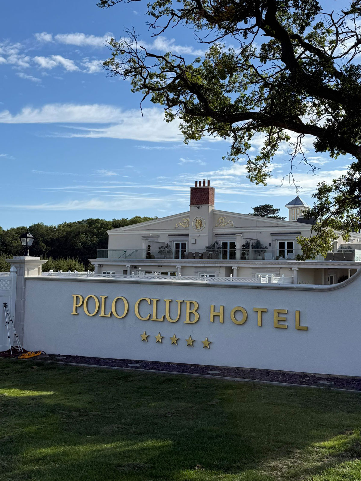 The Polo Club Hotel Southam exterior sign surrounded by grounds and trees in Warwickshire