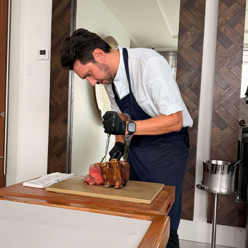 A joint of beef being carved at the table