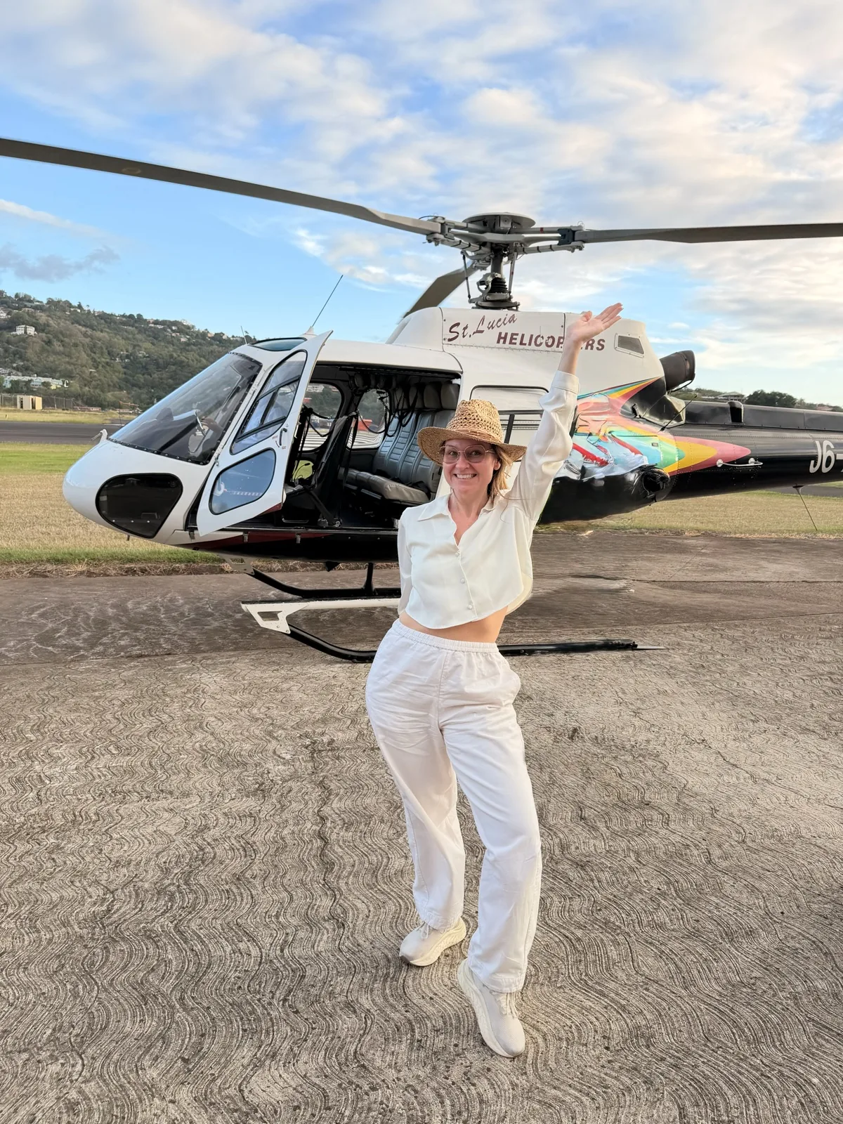 Arriving at the BodyHoliday by helicopter, on the landing pad beside a St Lucia Helicopters aircraft