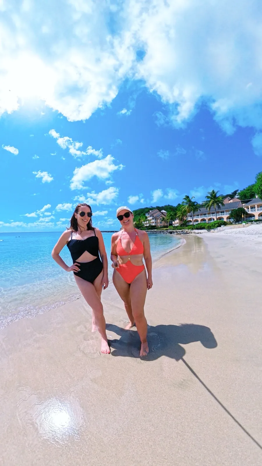 Walking along the white sand beach in the morning, the sea flat and clear