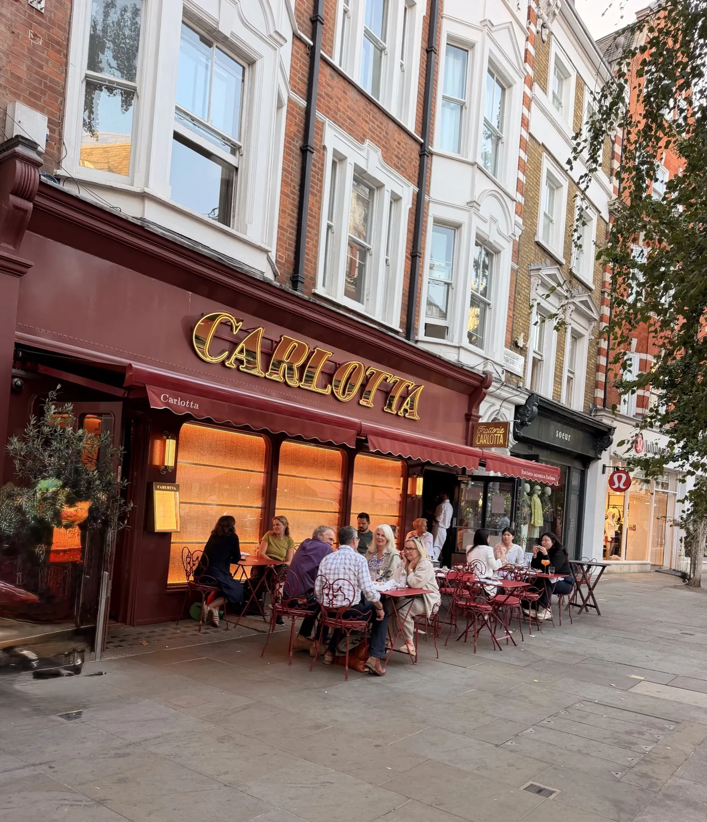 Carlotta Marylebone review: the red restaurant frontage with outdoor seating on Marylebone High Street