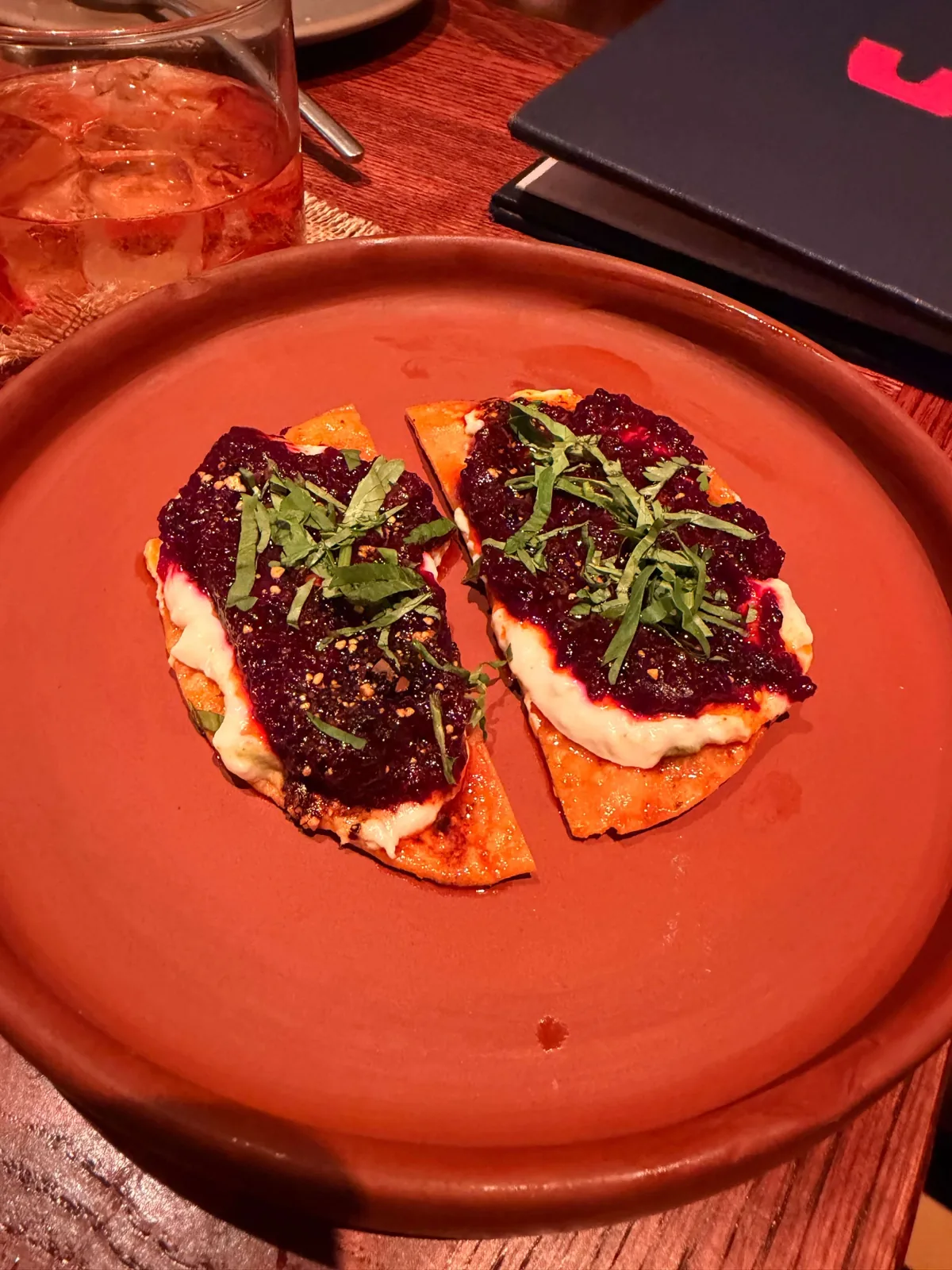 The beetroot and burrata tostada at Fonda Mayfair, a crisp round topped with beetroot and cream