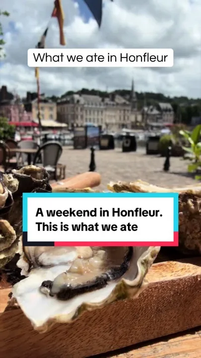 A weekend in Honfleur on video: oysters on a wooden board on a table overlooking the old harbour