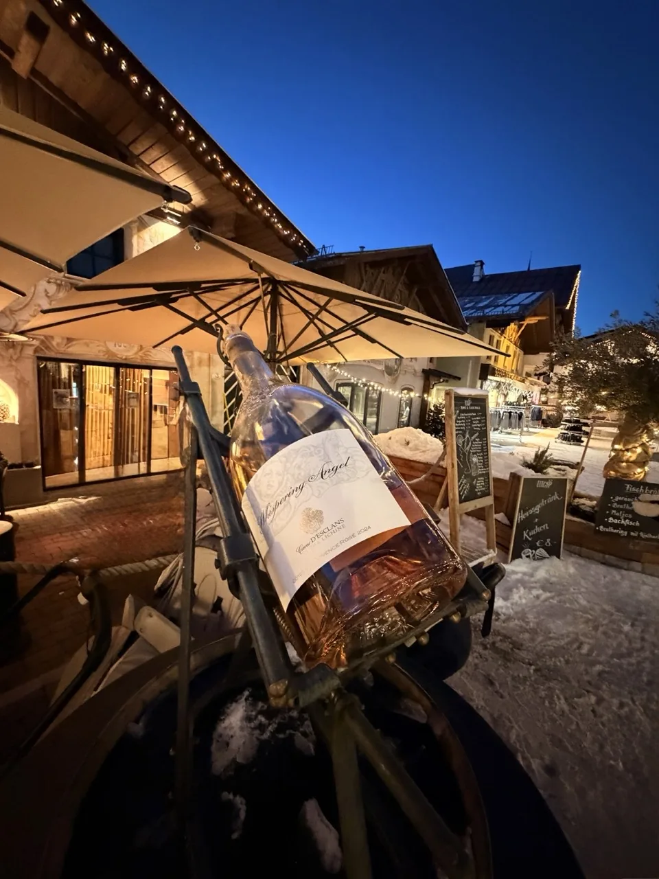 A bottle of Whispering Angel rosé on a table in Seefeld as the sun went down behind the chalets