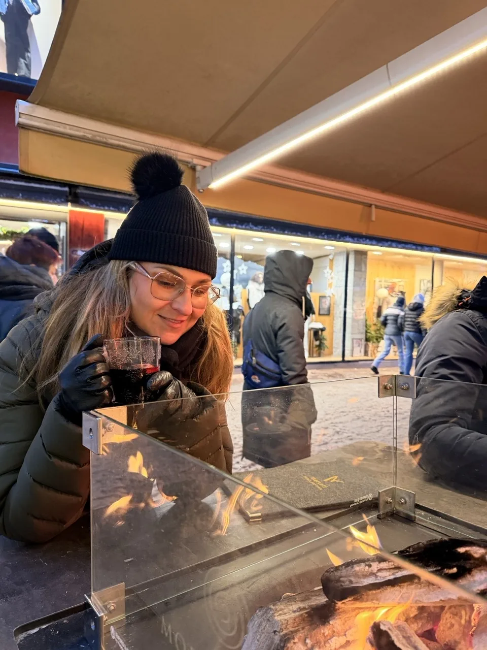 Warming up with a drink around an open fire pit on the main strip in Seefeld