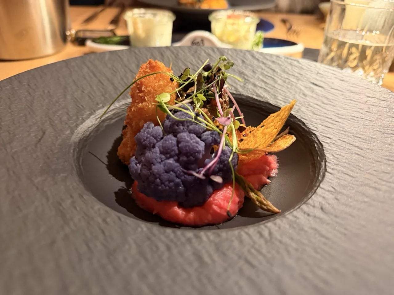 The main course of the Hotel Kristall Christmas Eve menu, with purple cauliflower and micro herbs