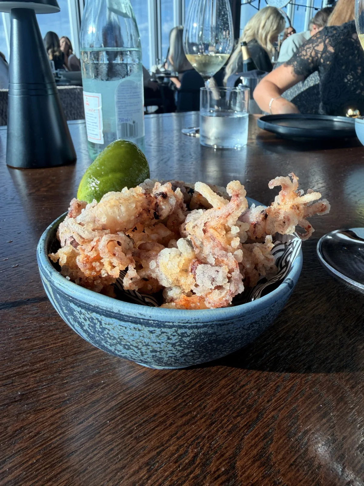 Baby squid with salt and vinegar, shichimi and szechuan pepper, served with the juiciest lime, at Lucky Cat London