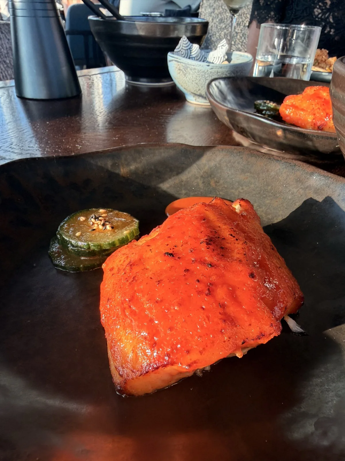Korean spiced black cod with sesame cucumbers, lacquered in a sticky citrus glaze, the standout dish at Lucky Cat 22 Bishopsgate