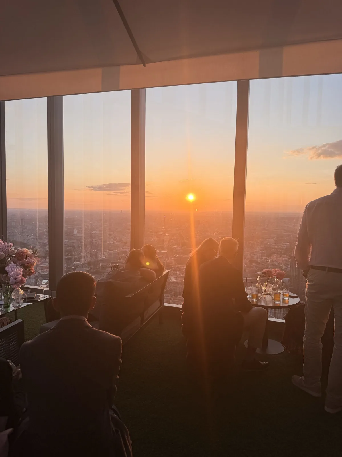 Sunset over the City of London seen through the floor to ceiling windows of Lucky Cat on Level 60 of 22 Bishopsgate