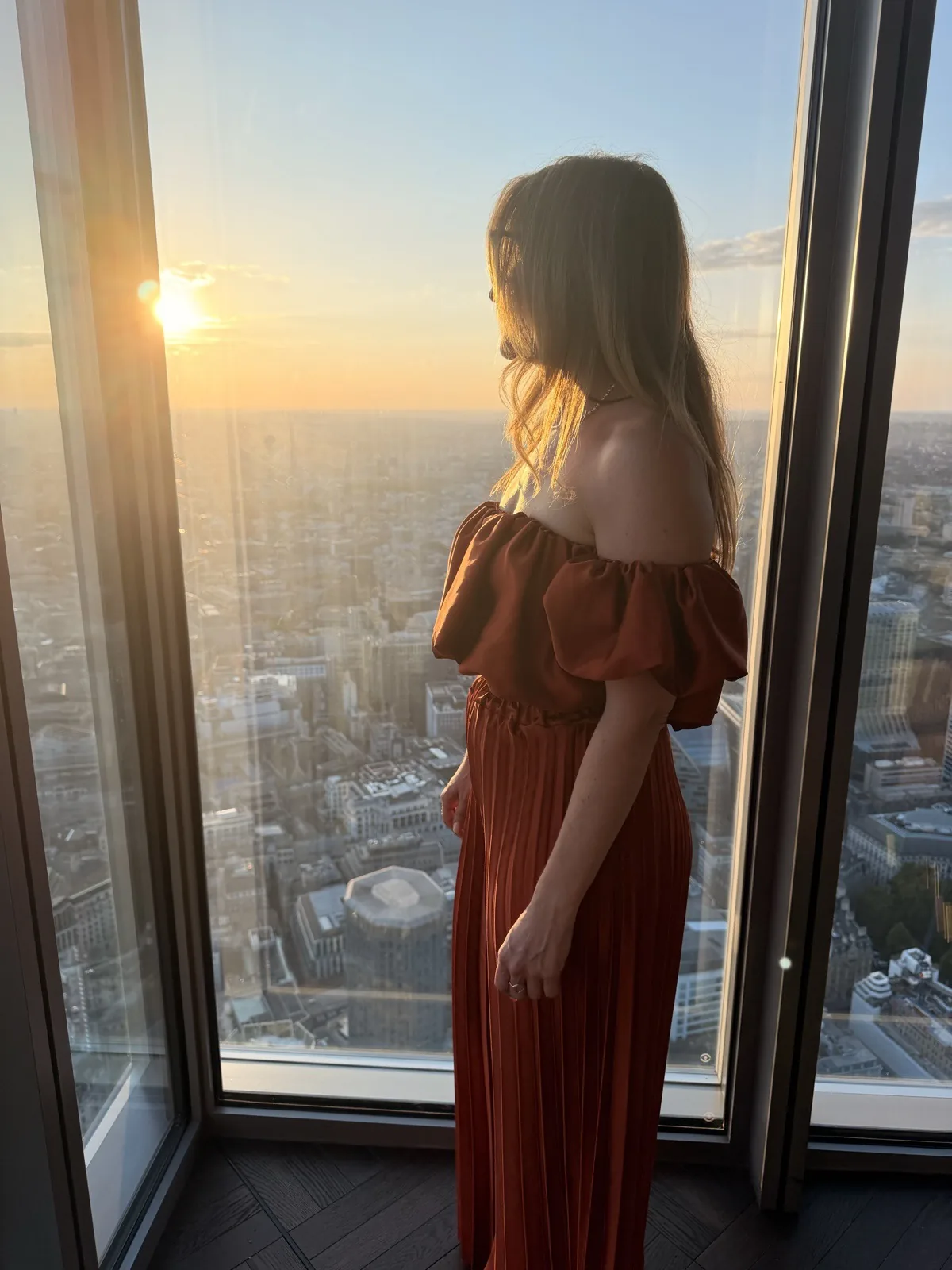 Watching the sun go down over London from the window at the top of 22 Bishopsgate