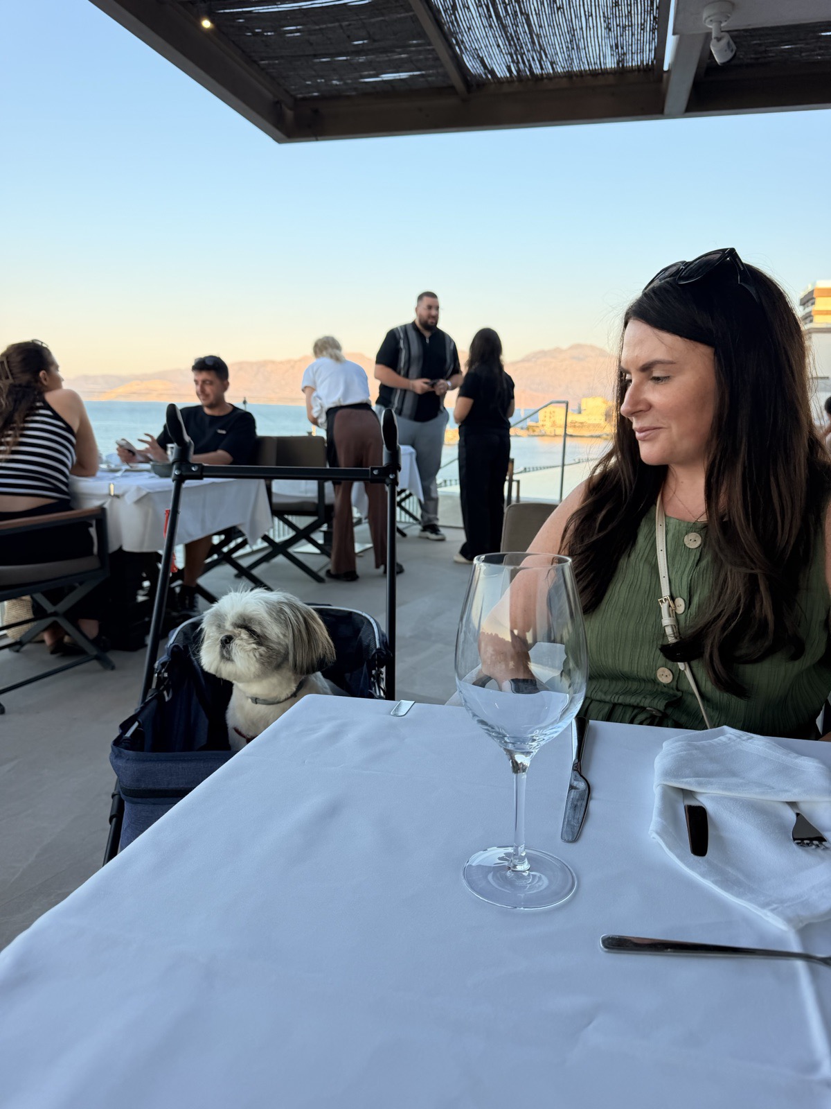 Pam and Daisy at dinner on the restaurant terrace, waiting for the starters to arrive