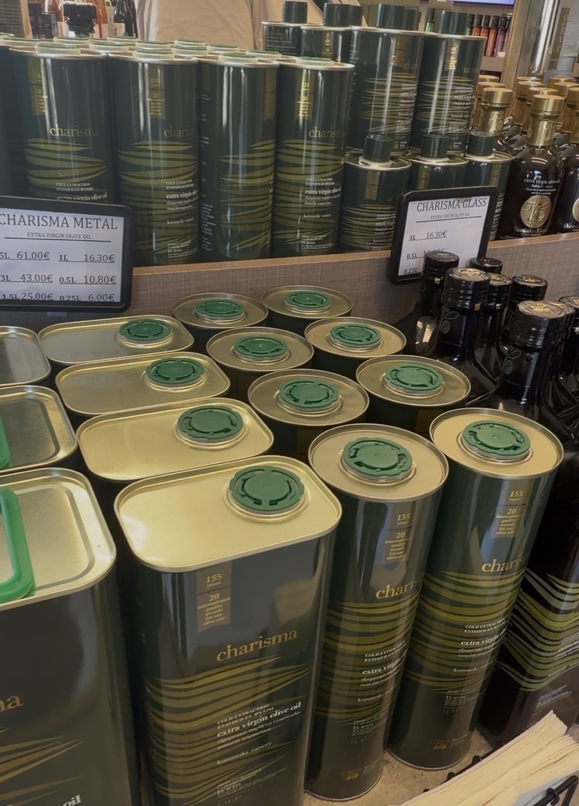 Stacked tins of Charisma for sale in the estate shop, beside the balsamics and the minis