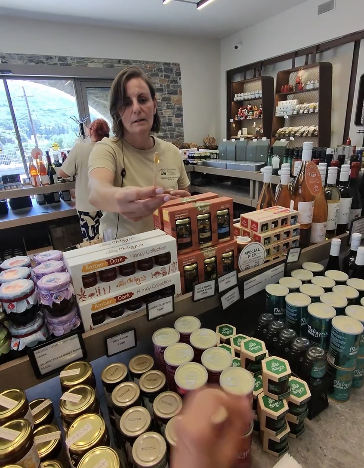 Carob syrup, orange balsamic and honey and thyme balsamic bottles in the Vassilakis Estate shop