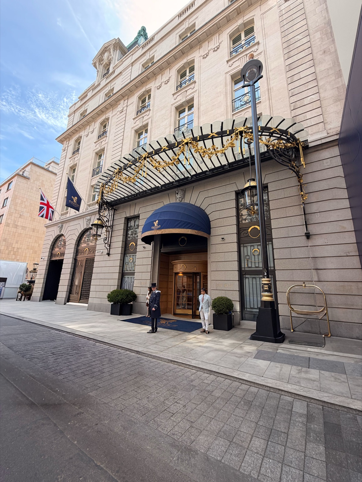 Doormen in top hats outside the entrance to The Ritz London on Piccadilly