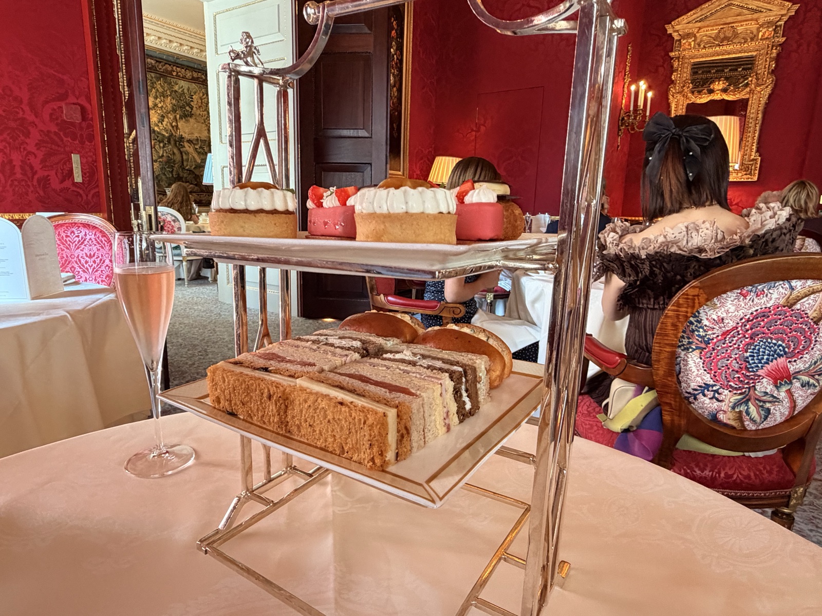 The three tier stand at The Ritz London holding all six finger sandwiches, ranked from the cucumber upwards