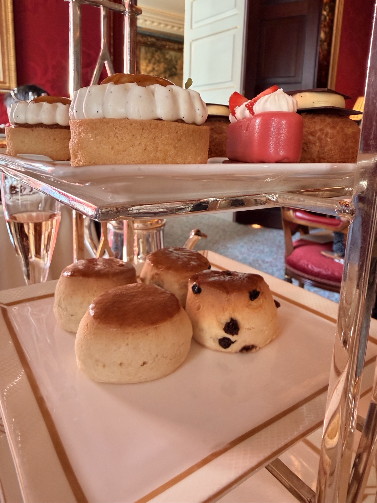 Freshly baked plain and fruit scones with Cornish clotted cream and strawberry preserve at The Ritz London