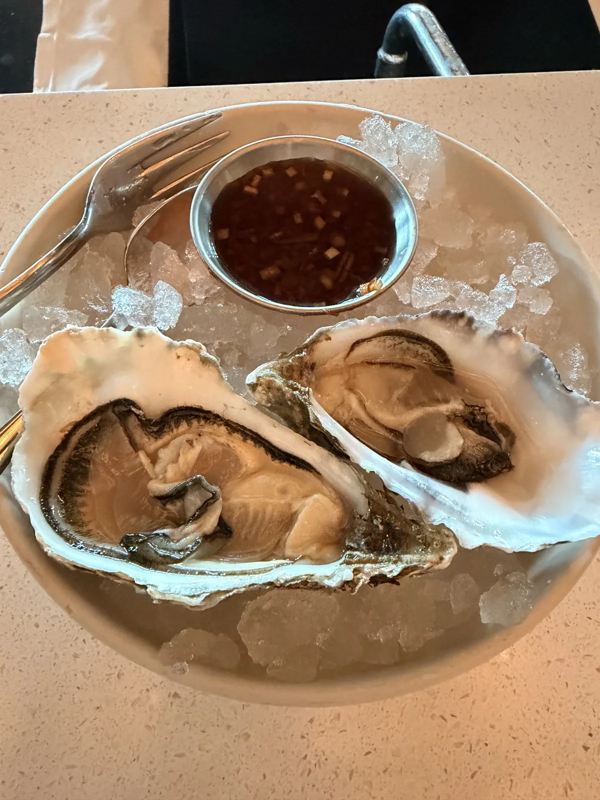 English coastal oysters with a blackcurrant mignonette, four pounds each, at the bar in Sea Containers London