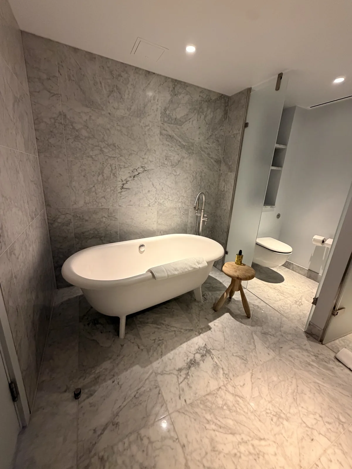 The roll top bath in the marble bathroom at Sea Containers London, with dimmable lighting