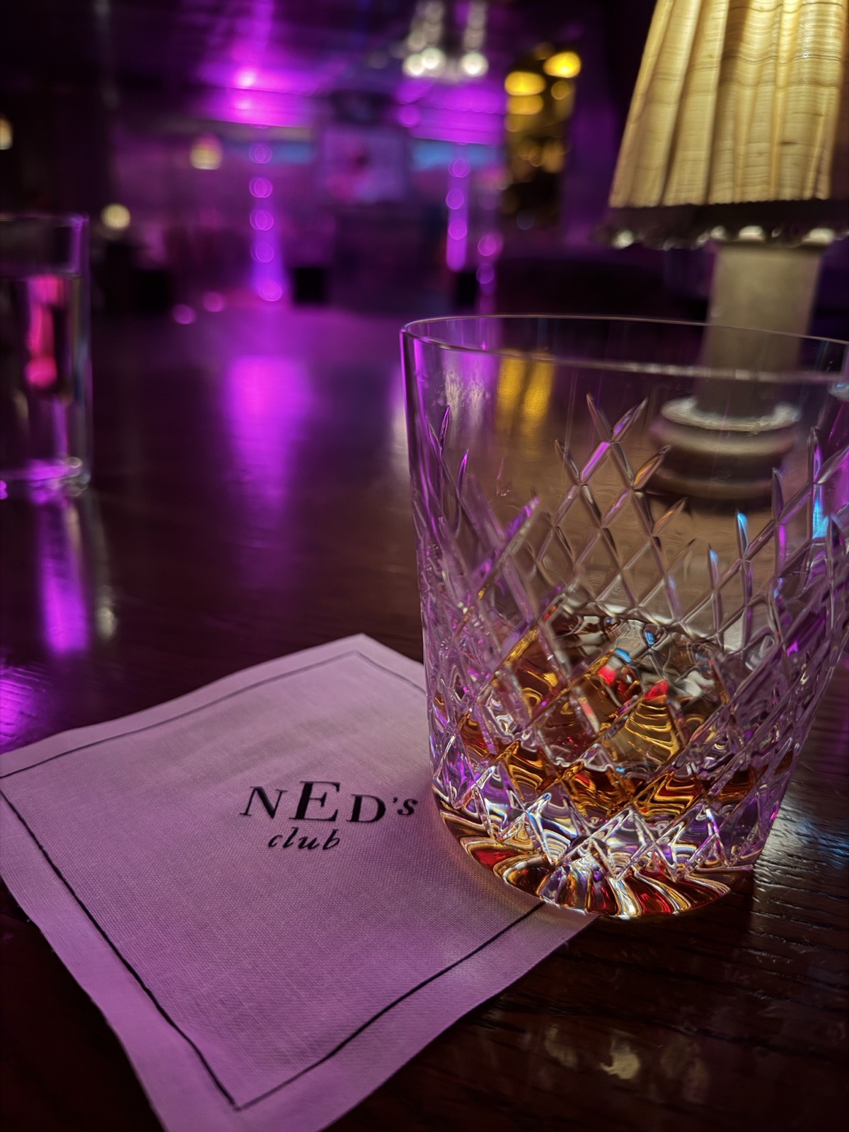 A neat Diplomatico rum on a Ned's Club napkin in the Vault bar