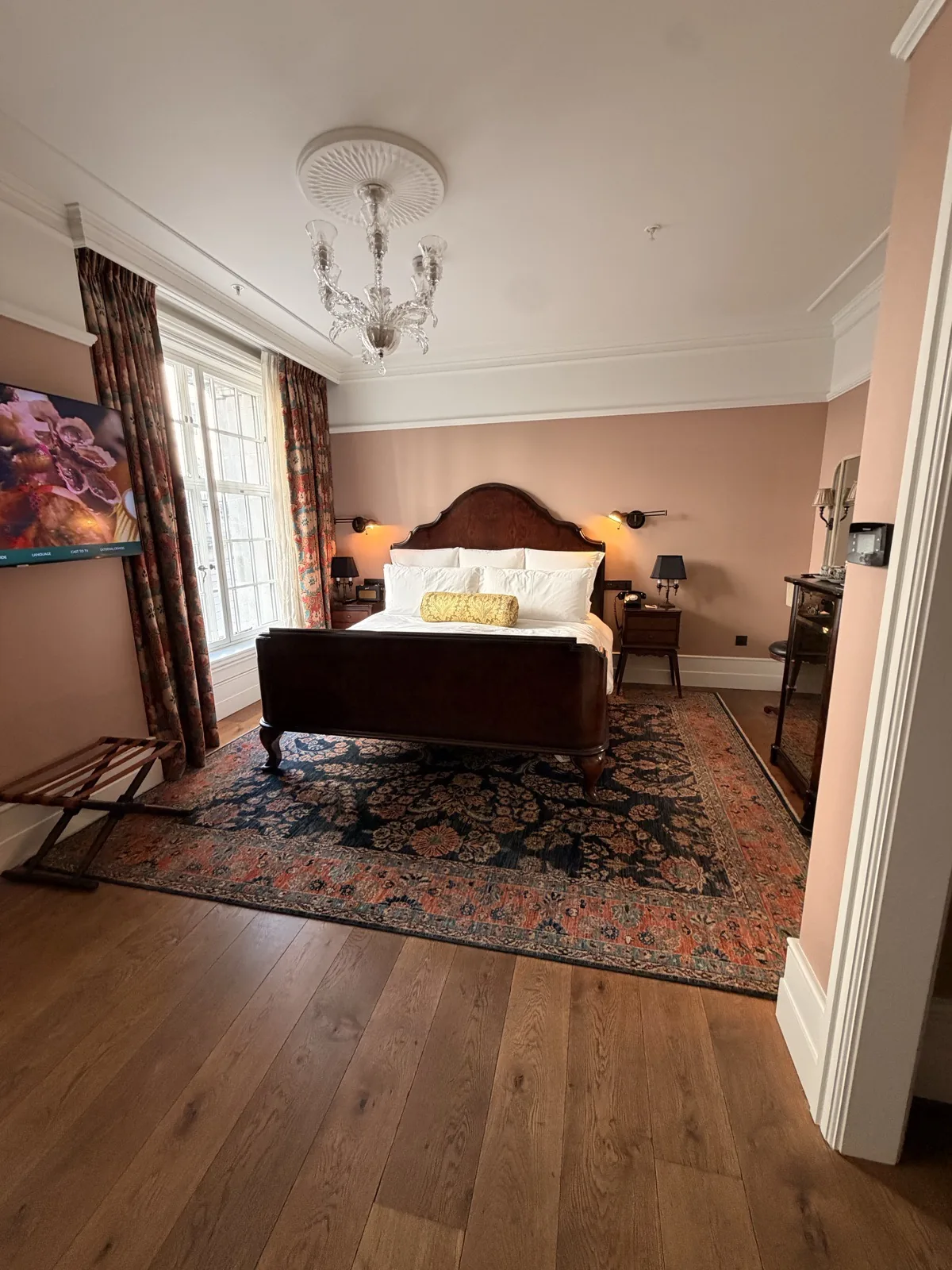 Medium room at The Ned London with a king size bed, Twenties styling and a chandelier