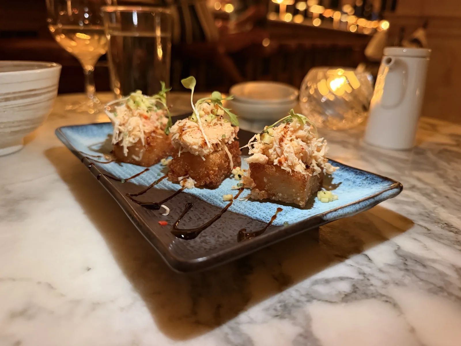 Snow crab bites on crispy rice with wasabi tobiko at Kaia, The Ned's Asian Pacific restaurant
