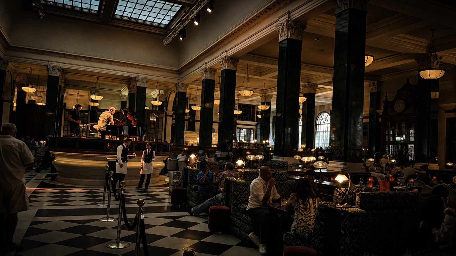 The Ned London review: the grand banking hall at night with its green verdite columns and the Nickel Stage
